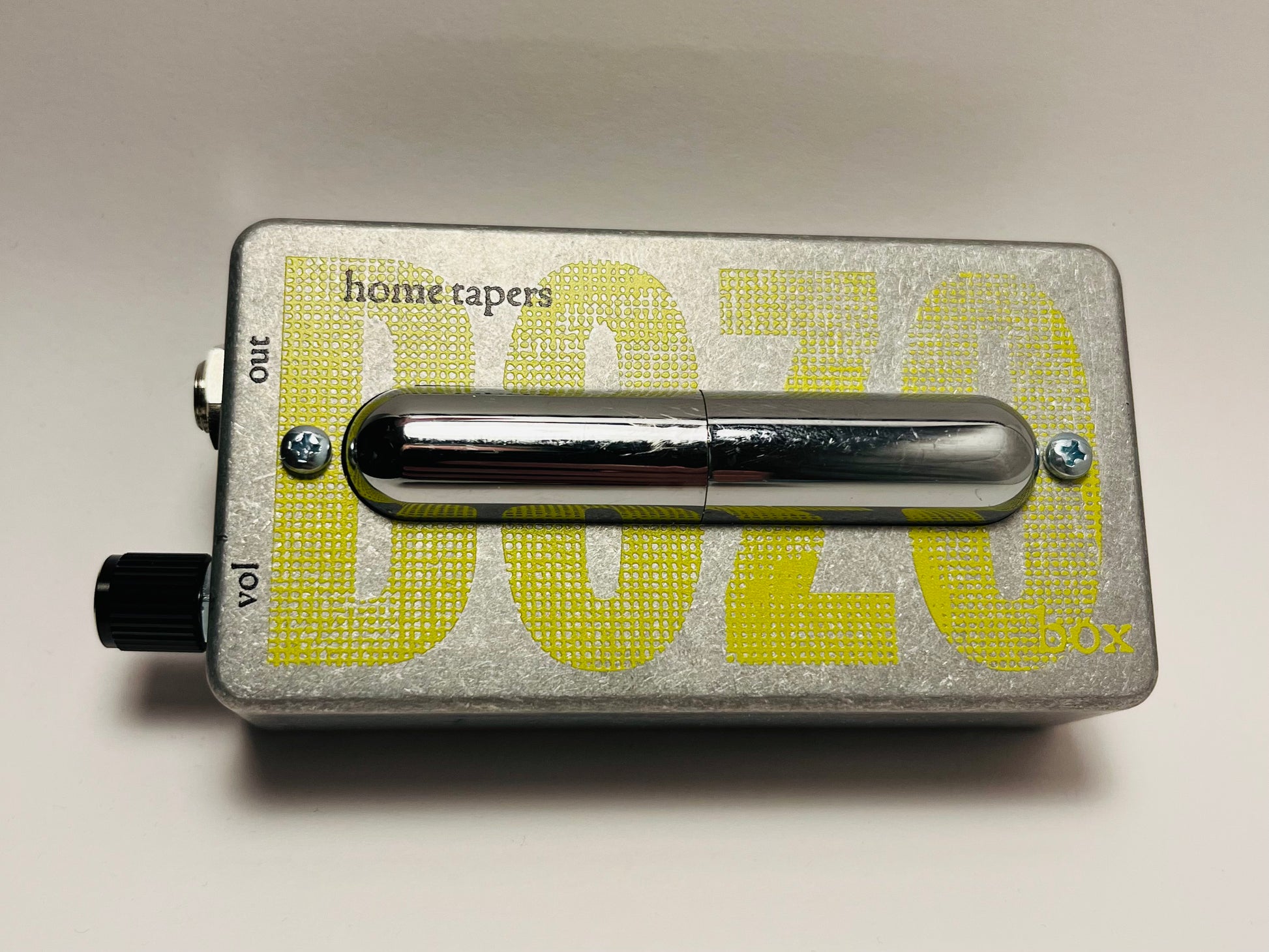 Metallic effect pedal with 'home tapers' branding on a light gray background