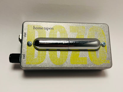 Metallic effect pedal with 'home tapers' branding on a light gray background